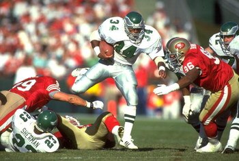 29 NOV 1992:  PHILADELPHIA EAGLES RUNNING BACK HERSCHEL WALKER #34 HURDLES A NUMBER OF SAN FRANCISCO 49ERS DEFENCMEN DURING THE EAGLES 20-14 LOSS AT CANDLESTICK PARK IN SAN FRANCISCO, CALIFORNIA.