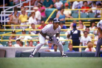 CHICAGO - 1987:  Rickey Henderson #24 of the New York Yankees leads-off of first base during a game against the Chicago White Sox in 1987 at Comiskey Park in Chicago, Illinois.  (Photo by Jonathan Daniel/Getty Images)