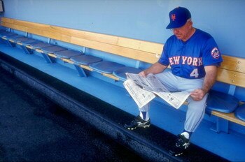 29 Aug 1998:  Coach Cookie Rojas #4 of the New York Mets reads a newspaper on the bench prior to a game against the Los Angeles Dodgers at Dodger Stadium in Los Angeles, California. The Mets defeated the Dodgers 4-3. Mandatory Credit: Donald Miralle  /All