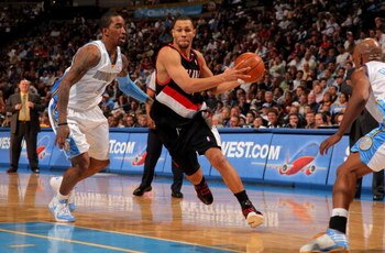 DENVER - MARCH 05:  Brandon Roy #7 of the Portland Trail Blazers drives past J.R. Smith #1 of the Denver Nuggets during NBA action at the Pepsi Center on March 5, 2009 in Denver, Colorado. The Nuggets defeated the Trail Blazers 106-90. NOTE TO USER: User 