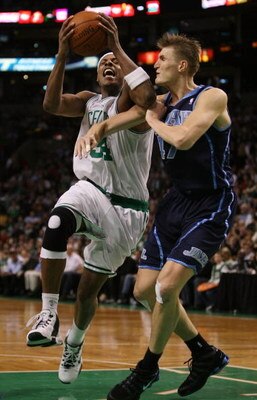 BOSTON - DECEMBER 15:  Paul Pierce #34 of the Boston Celtics is fouled by Andrei Kirilenko #47 of the Utah Jazz on December 15, 2008 at TD Banknorth Garden in Boston, Massachusetts. The Celtics defeated the Jazz 100-91. NOTE TO USER: User expressly acknow