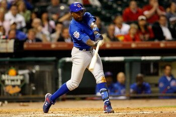 HOUSTON - APRIL 06:  Alfonso Soriano #12 of the Chicago Cubs gets a base hit against the Houston Astros on Opening Day on April 6, 2009 at Minute Maid Park in Houston, Texas.  (Photo by Chris Graythen/Getty Images)