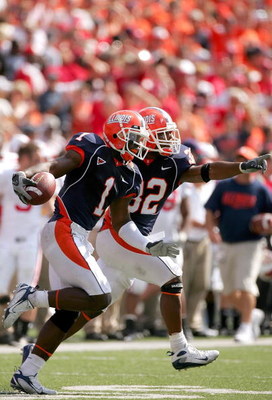 CHAMPAIGN, IL - OCTOBER 06: Vontae Davis #1 and Juston Harrison #32 of the Illinois Fighting Illini celebrate an interception against the Wisconsin Badgers October 6, 2007 at Memorial Stadium in Champaign, Illinois. (Photo by Matthew Stockman/Getty Imag