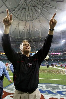 ATLANTA - DECEMBER 30:  Head coach Mark Richt of the Georgia Bulldogs celebrates after a 31-24 victory over the Virginia Tech Hokies during the Chick-fil-a Bowl on December 30, 2006 at the Georgia Dome in Atlanta, Georgia.  (Photo by Streeter Lecka/Getty 