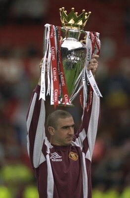 11 May 1997:  Eric Cantona of Manchester United holds aloft the FA Carling Premier League Championship Trophy after the match against West Ham United at Old Trafford in Manchester, England. Manchester United won 2-0. \ Mandatory Credit: Shaun Botterill /A