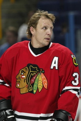 ST. LOUIS - OCTOBER 4:  Right wing Steve Thomas #32 of the Chicago Blackhawks looks on in warm-ups prior to the start of the NHL preseason game against the St. Louis Blues on October 4, 2002 at the Savvis Center in St. Louis, Missouri.  The St. Louis Blue