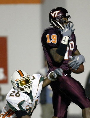 BLACKSBURG, VA - NOVEMBER 1:  Sean Taylor #26 of the Miami Hurricanes can't break up the touchdown pass to Ernest Wilford #19 of the Virginia Tech Hokies November 1, 2003 at Lane Stadium in Blacksburg, Virgina.   (Photo by Craig Jones/Getty Images)
