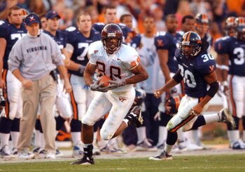 17 Nov 2001:  Andre Davis #88 of the Virginia Tech Hokies heads for the endzone for a secound quarter touchdown as head coach Al Groh, left, and Shenard Newby #20 of the University of Virginia Cavaliers can only watch at Scott Stadium on the campus if the