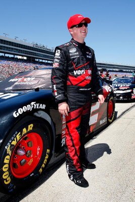 FORT WORTH, TX - APRIL 04:  Justin Allgaier, driver of the #12 Verizon FIOS Dodge, stands on the grid during the NASCAR Nationwide Series O'Reilly 300 at Texas Motor Speedway on April 4, 2009 in Fort Worth, Texas.  (Photo by John Harrelson/Getty Images)