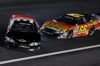 CONCORD, NC - OCTOBER 10:  Jeff Green, driver of the  #31 Key Motorsports Chevrolet, spins out after making contact with Steven Wallace, driver of the #66 5-Hour Energy Chevrolet, during the NASCAR Nationwide Series Dollar General 300 at Lowe's Motor Spee