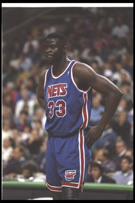 1 Dec 1995:  Center Yinka Dare of the New Jersey Nets looks on during a game against the Boston Celtics at the FleetCenter in Boston, Massachusetts.  The Nets won the game, 131-123. Mandatory Credit: Allsport  /Allsport