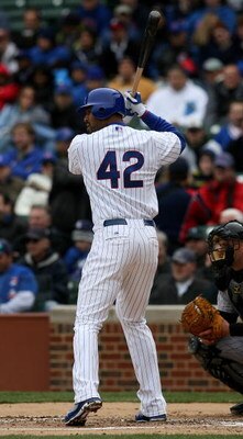 CHICAGO - APRIL 15: Derrek Lee of the Chicago Cubs, wearing a #42 jersey during the Jackie Robinson Day game, prepares to hit against the Colorado Rockies on April 15, 2009 at Wrigley Field in Chicago, Illinois. (Photo by Jonathan Daniel/Getty Images)