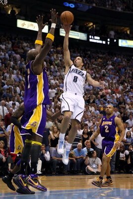 SALT LAKE CITY - MAY 16:  Deron Williams #8 of the Utah Jazz goes up for a shot against Lamar Odom #7 of the Los Angeles Lakers in Game Six of the Western Conference Semifinals during the 2008 NBA Playoffs at EnergySolutions Arena on May 16, 2008 in Salt 