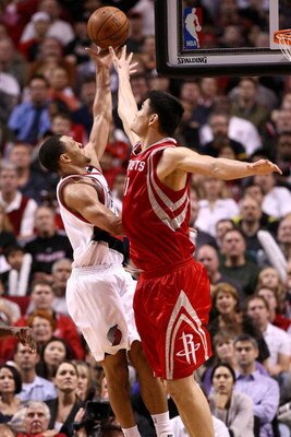 PORTLAND, OR - NOVEMBER 06:  Brandon Roy #7 of the Portland Trail Blazers lays the ball up against Yao Ming #11  of the Houston Rockets at the Rose Garden on November 6, 2008 in Portland, Oregon.  NOTE TO USER: User expressly acknowledges and agrees that,