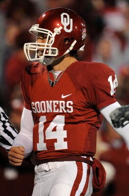 NORMAN, OK - NOVEMBER 22:  Quarterback Sam Bradford #14 of the Oklahoma Sooners celebrates a touchdown against the Texas Tech Red Raiders in the second quarter at Memorial Stadium on November 22, 2008 in Norman, Oklahoma.  (Photo by Ronald Martinez/Getty 