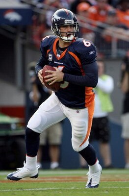 DENVER - NOVEMBER 02:  Quarterback Jay Cutler #6 of the Denver Broncos rolls out and looks for a receiver against the Miami Dolphins during NFL action at Invesco Field at Mile High on November 2, 2008 in Denver, Colorado. The Dolphins defeated the Broncos