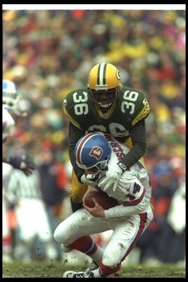 8 Dec 1996:  Safety LeRoy Butler of the Green Bay Packers tackles Denver Broncos quarterback Bill Musgrave during a game at Lambeau Field in Green Bay, Wisconsin.  The Packers won the game, 41-6. Mandatory Credit: Brian Bahr  /Allsport