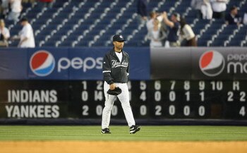 NEW YORK - APRIL 18:  Mariano Rivera #42 of the New York Yankees walks to the dugout from the bullpen, past the scoreboard after the game against the Cleveland Indians at Yankee Stadium on April 18, 2009 in the Bronx borough of New York City.  (Photo by N