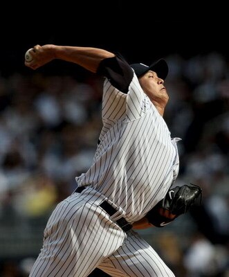 NEW YORK - APRIL 18: Chien-Ming Wang #40  of the New York Yankees pitches against the Cleveland Indians at Yankee Stadium on April 18, 2009 in the Bronx borough of New York City. Wang gave up 8 runs in 1.1 innings.  (Photo by Nick Laham/Getty Images)