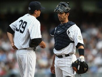 NEW YORK - APRIL 18:  Anthony Claggett #39 of the New York Yankees talks with catcher Jorge Posada #20 against the Cleveland Indians at Yankee Stadium on April 18, 2009 in the Bronx borough of New York City.  (Photo by Nick Laham/Getty Images)