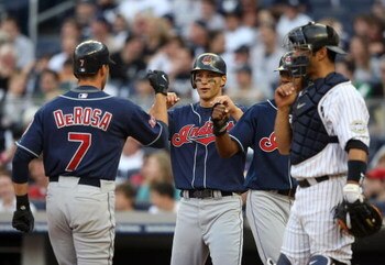 NEW YORK - APRIL 18:  Mark DeRosa #7 of the Cleveland Indians celebrates hitting a three run home run iwith scoring batters Grady Sizemore #24 and Ben Francisco #12 against the New York Yankees at Yankee Stadium on April 18, 2009 in the Bronx borough of N