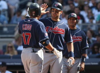 NEW YORK - APRIL 18:  Shin-Soo Choo #17 of the Cleveland Indians celebrates hitting a three run home run in the second inning with scoring batters Travis Hafner #48 and Jhonny Peralta #2 against the New York Yankees at Yankee Stadium on April 18, 2009 in 