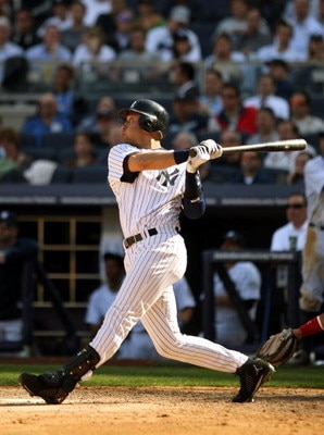 NEW YORK - APRIL 17:  Derek Jeter #2 of the New York Yankees hits a home run in the eighth inning of their game to give them a 6-5 lead over the Cleveland Indians at Yankee Stadium on April 17, 2009 in the Bronx borough of New York City.  (Photo by Ezra S