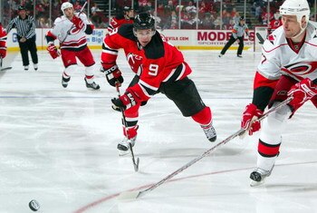 NEWARK, NJ - APRIL 11:  Zach Parise #9 of the New Jersey Devils skates against the Carolina Hurricanes at the Prudential Center on April 11, 2009 in Newark, New Jersey. The Devils defeated the Hurricanes 3-2.  (Photo by Jim McIsaac/Getty Images)
