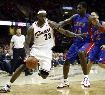 CLEVELAND - APRIL 18:  LeBron James #23 of the Cleveland Cavaliers dribbles by Antonio McDyess #24 of the Detroit Pistons during Game One of the Eastern Conference Quarterfinals during the 2009 NBA Playoffs at Quicken Loans Arena on April 18, 2009 in Clev