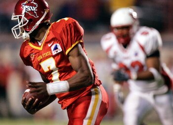 NEW ORLEANS - DECEMBER 28:  Bret Meyer #7 of Iowa State scrambles around Jeff Schroeder #23 of Miami of Ohio during the Independence bowl at Independence Stadium on December 28, 2004 in Shreveport, Louisiana. Iowa defeated Miami of Ohio 17-13.  (Photo by 