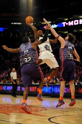 PHOENIX - FEBRUARY 13:  Rodney Stuckey #3 of the Sophomore team goes up for a shot over O.J. Mayo #32 and Marc Gasol #33 of the Rookie team during the T-Mobile Rookie Challenge & Youth Jam part of 2009 NBA All-Star Weekend at US Airways Center on February