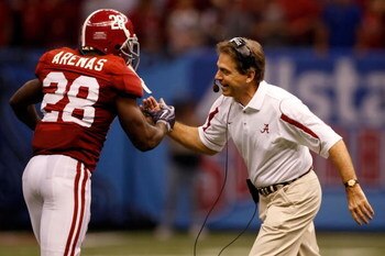 NEW ORLEANS - JANUARY 02:  Kick returner Javier Arenas #28 of the Alabama Crimson Tide celebrates with head coach Nick Saban after Arenas scored on a 73-yard punt return in the second quarter against the Utah Utes during the 75th Allstate Sugar Bowl at th