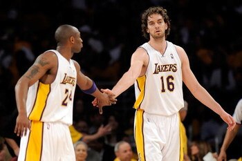 LOS ANGELES, CA - APRIL 19:  (L-R) Kobe Bryant #24 and Pau Gasol #16 of the Los Angeles Lakers give each other a five in the first quarter against the Utah Jazz in Game One of the Western Conference Quarterfinals during the 2009 NBA Playoffs at Staples Ce