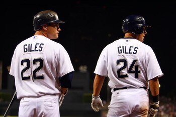 SAN DIEGO - AUGUST 16:  Brothers and teammates Marcus Giles #22 and Brian Giles #24 of the San Diego Padres prepare themselves to bat in the on deck circle against the Colorado Rockies during  their MLB Game on August 16, 2007 at Petco Park in San Diego, 