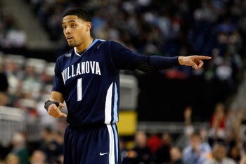 DETROIT - APRIL 04:  Scottie Reynolds #1 of the Villanova Wildcats points while taking on the North Carolina Tar Heels during the National Semifinal game of the NCAA Division I Men's Basketball Championship at Ford Field on April 4, 2009 in Detroit, Michi