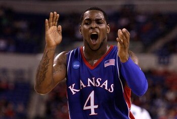 INDIANAPOLIS - MARCH 27:  Sherron Collins #4 of the Kansas Jayhawks reacts in the first half against the Michigan State Spartans during the third round of the NCAA Division I Men's Basketball Tournament at the Lucas Oil Stadium on March 27, 2009 in Indian