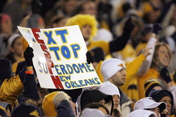MORGANTOWN, WV - DECEMBER 1: A fan of the West Virginia Mountaineers holds up a ESPN sign during the game against the Pittsburgh Panthers at Milan Puskar Stadium on December 1, 2007 in Morgantown, West Virginia. (Photo by Kevin C. Cox/Getty Images)