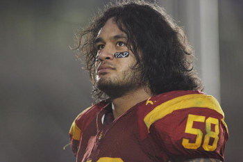 PASADENA, CA - DECEMBER 6: Rey Maualuga #58 of the USC Trojans reflects after celebrating with the band and fans following the victory against the UCLA Bruins on December 6, 2008 at the Rose Bowl in Pasadena, California. USC won 28-7. (Photo by Jeff Go