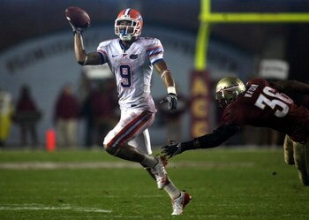 TALLAHASSEE, FL - NOVEMBER 29:  Receiver Louis Murphy #9 of the Florida Gators throws the ball against linebacker Dekoda watson #36 of the Florida State Seminoles during the first half at Bobby Bowden Field at Doak Campbell Stadium on November 29, 2008 in