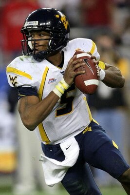GLENDALE, AZ - JANUARY 02:  Quarterback Patrick White #5 of the West Virginia Mountaineers scrambles against the Oklahoma Sooners at the Tostito's Fiesta Bowl at University of Phoenix Stadium January 2, 2008 in Glendale, Arizona.  (Photo by Stephen Dunn/G