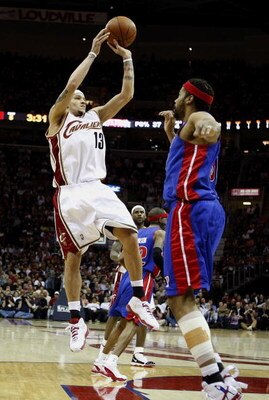 CLEVELAND - APRIL 21: Delonte West #13 of the Cleveland Cavaliers attempts a shot over Rasheed Wallace #30 of the Detroit Pistons in Game Two of the Eastern Conference Quarterfinals during the 2009 NBA Playoffs at Quicken Loans Arena on April 21, 2009 in 