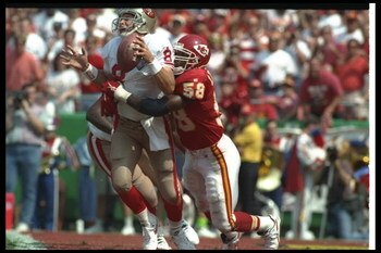 11 Sep 1994:  Linebacker Derrick Thomas of the Kansas City Chiefs sacks San Francisco 49ers quarterback Steve Young during a game at Arrowhead Stadium in Kansas City, Missouri.  The Chiefs won the game, 24-17. Mandatory Credit: Mike Powell  /Allsport
