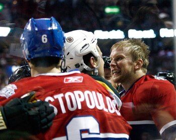 MONTREAL - OCTOBER 15:  Mike Komisarek #8 of the Montreal Canadiens and Milan Lucic #17 of the Boston Bruins exchange words during the game at the Bell Centre on October 15, 2008 in Montreal, Quebec, Canada.   (Photo by Richard Wolowicz/Getty Images)