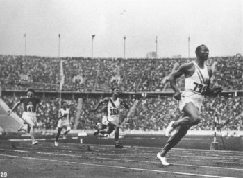 2 Aug 1936:  Jesse Owens of the USA crosses the finishing line during the 100 metres event at the 1936 Olympic Games in Berlin. Owens won the gold medal with a time of 10.3 seconds. \ Mandatory Credit: IOC Olympic Museum  /Allsport