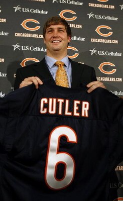 LAKE FOREST, IL - APRIL 3: Quarterback Jay Cutler of the Chicago Bears holds up his #6 jersey after he was introduced as their new quarterback during a press conference on April 3, 2009 at Halas Hall in Lake Forest, Illinois. (Photo by Jim Prisching/Getty