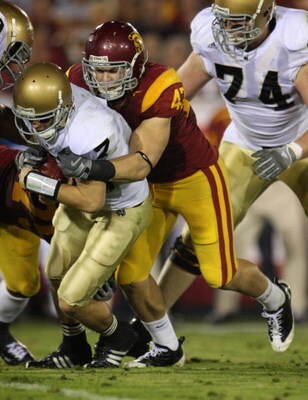 LOS ANGELES, CA - NOVEMBER 29:  Quarterback Jimmy Clausen #7 of the Notre Dame Fighting Irish is sacked by Clay Matthews #47 of the USC Trojans  during the first half at the Memorial Coliseum on November 29, 2008 in Los Angeles, California.  (Photo by Jef
