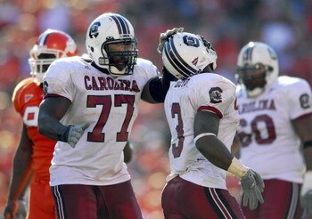 CLEMSON, SC - NOVEMBER 25:Jamon Meredith #77 of the South Carolina Gamecocks congratulates Cory Boyd #3 during the game against the Clemson Tigers at Memorial Stadium on November 25, 2006 in Clemson, South Carolina. South Carolina won 31-28. (Photo by Gra