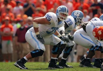 CLEMSON, SC - SEPTEMBER 23:  (L-R) Garrett Reynolds #75 and Calvin Darity #49 of the University of North Carolina Tar Heels line up at the line of scrimmage against the Clemson Tigers during their game on September 23, 2006 at Memorial Stadium in Clemson,