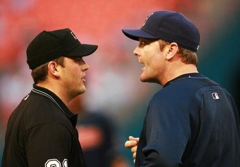 MIAMI - JUNE 12:   Manager Eric Wedge #22 of the Cleveland Indians argues with first base umpire Brian Knight #91 after first baseman Travis Hafner #48 missed a tag on Alfredo Amezaga #4 of the Florida Marlins during interleague play at Dolphin Stadium on