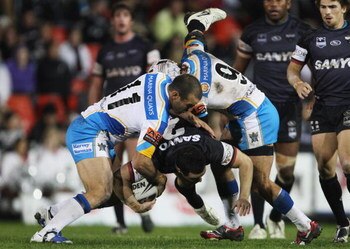 SYDNEY, AUSTRALIA - APRIL 27:  Michael Gordon of the Panthers is lifted ina  tackle during the round seven NRL match between the Penrith Panthers and the Gold Coast Titans at CUA Stadium on April 27, 2009 in Sydney, Australia.  (Photo by Mark Kolbe/Getty 